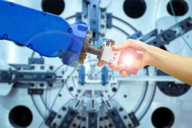 Endüstriyel robot tokalaşması, endüstriyel imalat üzerinde çalışmak için endüstriyel sanayi 4.0, işaret fişeği filtresi ve bulanık makineler üzerinde çalışmak için mavi arkaplan üzerinde çalışmak için insan ilişkileri üzerine.