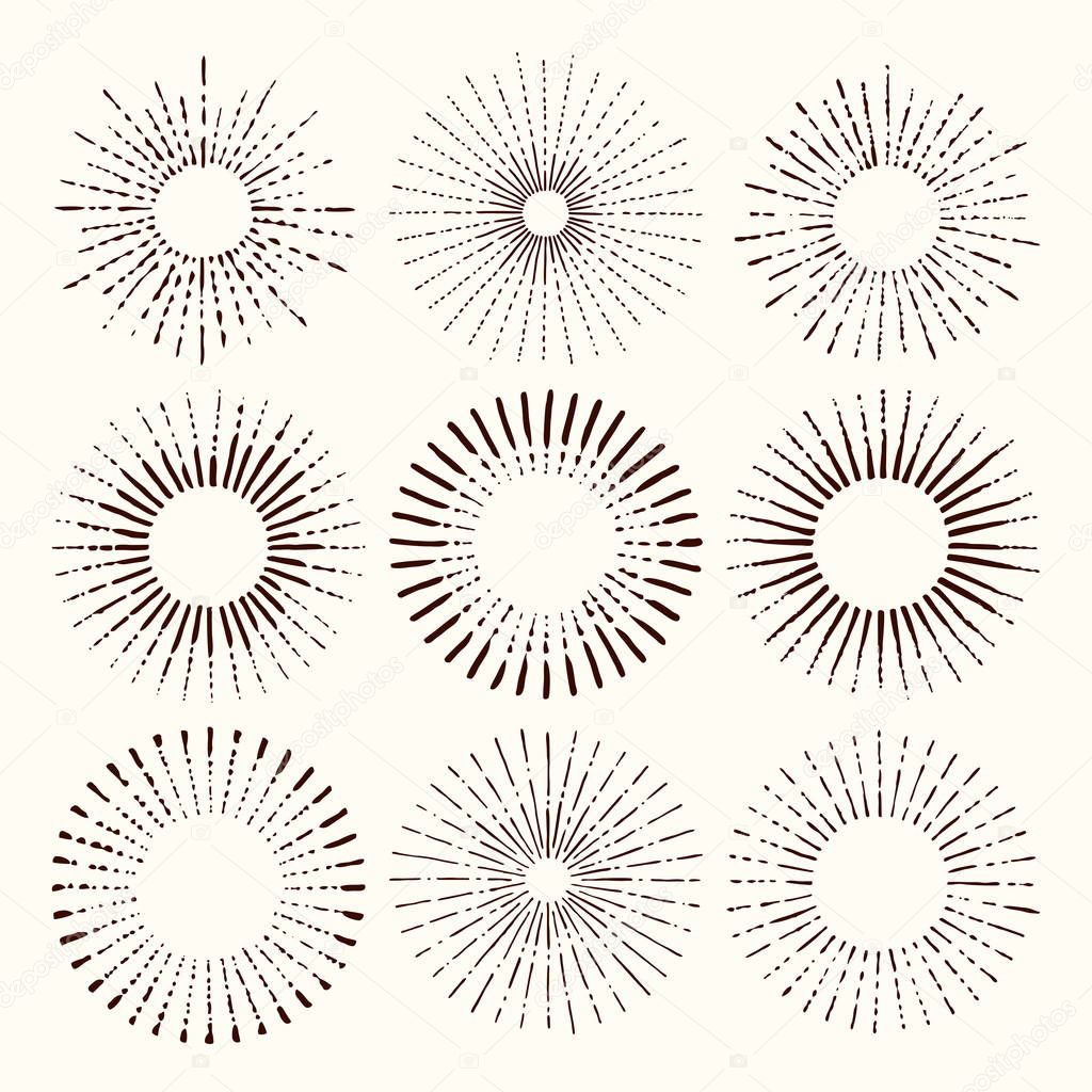 Set and collection of trendy hand drawn retro sunburst/bursting rays design elements.