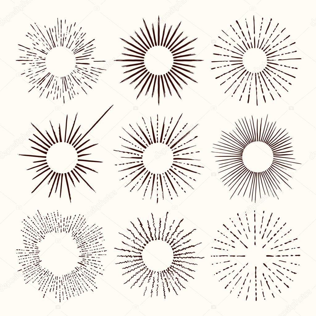 Set and collection of trendy hand drawn retro sunburst/bursting rays design elements.