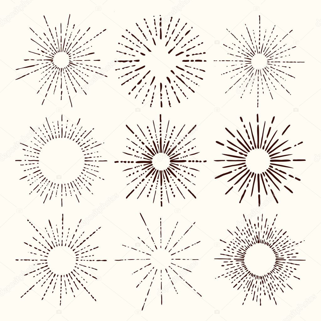 Set and collection of trendy hand drawn retro sunburst/bursting rays design elements.