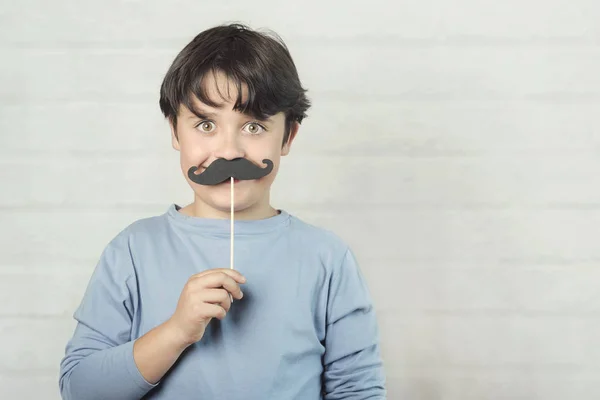 Happy father��s day,boy with false mustache on stick — Stok Foto