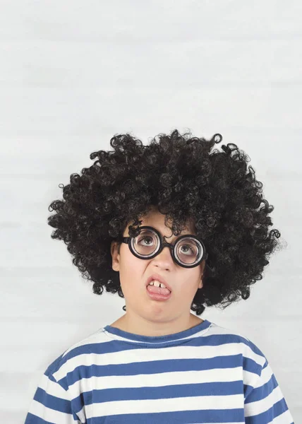 Funny child making a grimace wearing nerd glasses — Stock Photo, Image