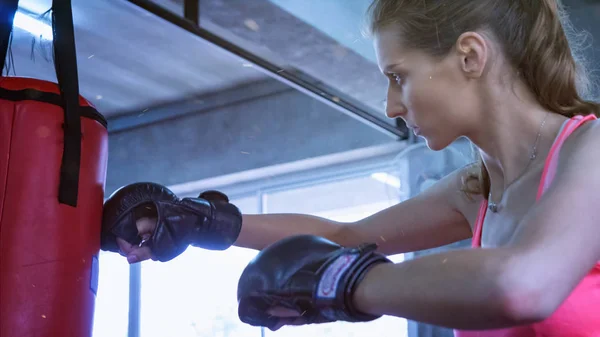 women boxing at gym