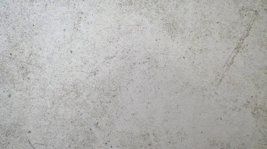 Çizik ve çatlaklarla dolu beton doku.