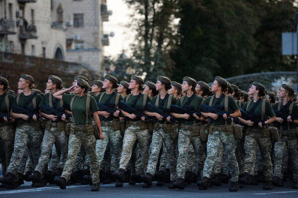 Female soldiers of a womens battalion marching on a square with machine guns. Military parade dedicated to Day of Independence of Ukraine. August 24, 2018. Kiev, Ukraine