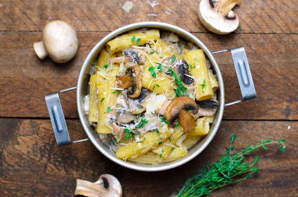 Creamy Mushroom Pasta with Fresh Thyme and Parmesan in a Vintage Pot, Italian Cuisine