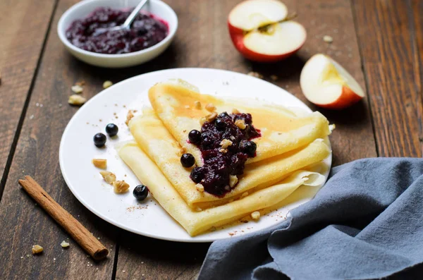 Crepes with Black Currant Jam on Dark Wooden Background, Homemade Dessert