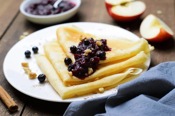 Crepes with Black Currant Jam on Dark Wooden Background, Homemade Dessert