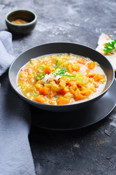 Rice and Pumpkin Indian Soup on Dark Background