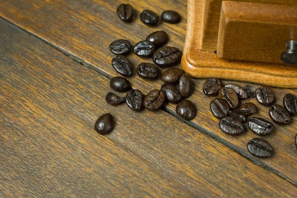 The vintage roaster coffee  on wood table.