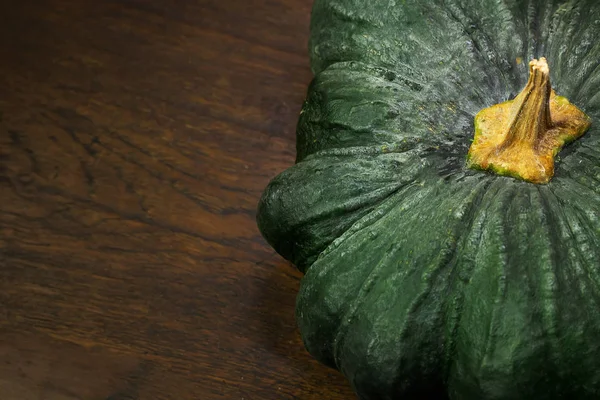 Green pumpkin on wood table image close up. — Stock Photo, Image