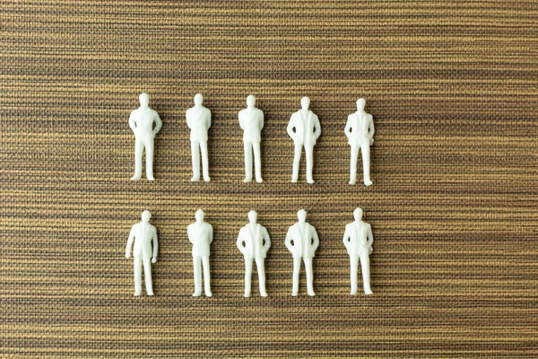 White figure miniature  on wood for business content. — Stock Photo, Image