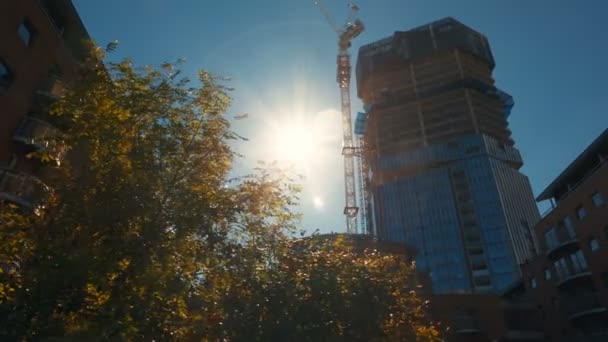 Tracking Shot Large Building Office Suites Construction Bright Blue Sky — Stock Video