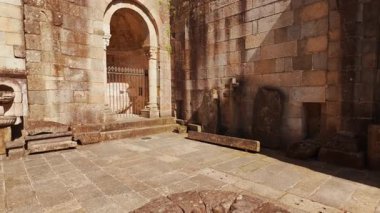 Braga Cathedral exteriors display Romanesque portals gothic pinnacles and weathered granite walls anchoring the old town in Braga, Portugal