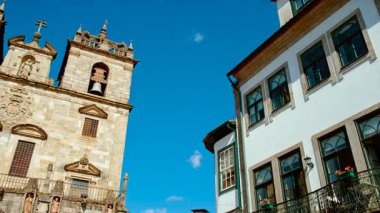 Braga Cathedral exteriors display Romanesque portals gothic pinnacles and weathered granite walls anchoring the old town in Braga, Portugal