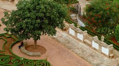 BARCELOS, Portugal, 19 June 2025 - Barrocas Gardens in Barcelos, Portugal offers a calm urban green space with tree lined paths trimmed hedges and seasonal flower beds