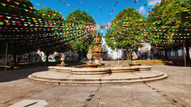 Municipal Square in Braga, Portugal opens as a central civic space with stone paving water features and surrounding public buildings where people meet and pass through