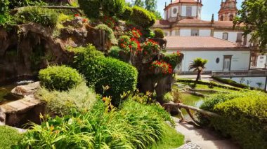 BRAGA, Portugal, 17 June 2025 - Sanctuary of Bom Jesus do Monte crowns the summit with white baroque church monumental stairway and panoramic views across Braga, Portugal