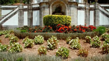 Sanctuary of Bom Jesus do Monte crowns the summit with white baroque church monumental stairway and panoramic views across Braga, Portugal