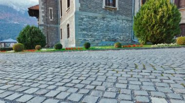 BUSTENI, Romania, 12 October 2024 - Cantacuzino Castle, Busteni, Transylvania, Romania, presents stone terraces, decorative arches, and a hilltop setting, with landscaped grounds