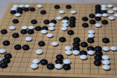 The game of go is enjoyed all over the world. clipart
