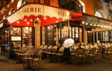 The traditional French cafe Chatelet at night , Paris, France. clipart