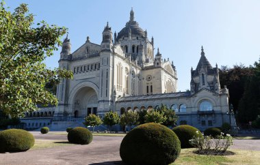 The famous basilica of St. Therese of Lisieux in Normandy, France.The second-most visited pilgrimage site in France after Lourdes, it welcomes over 2 million visitors annually . clipart