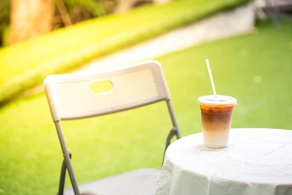 The cup of coffee iced Late  in the cafe\'s garden