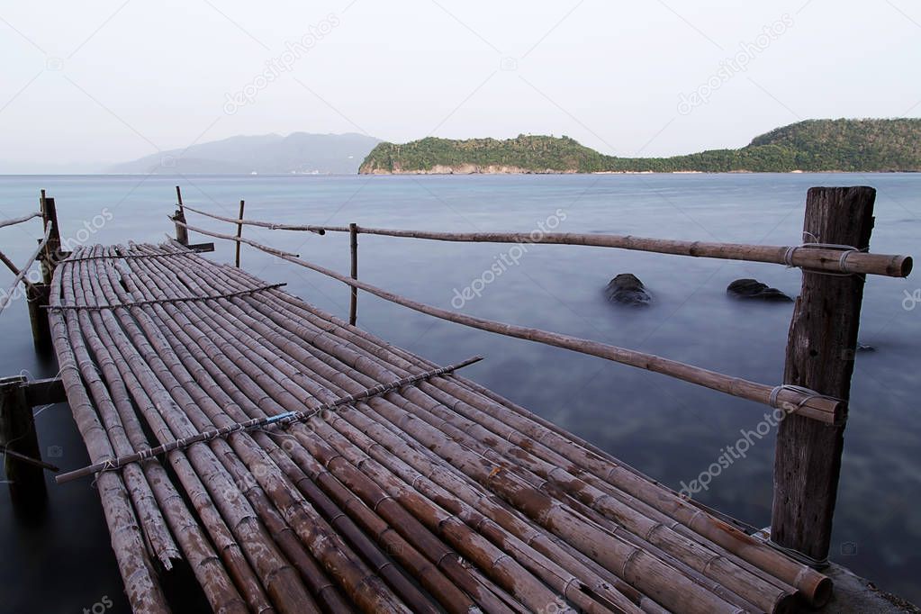 A wooden bridge pier to the sea on Tingloy island, Philippines