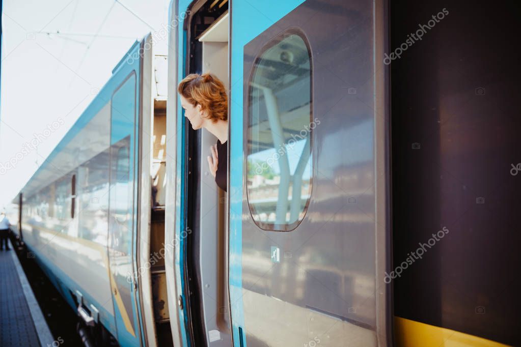 businessman with luggage traveling by speed train at business meeting about transport