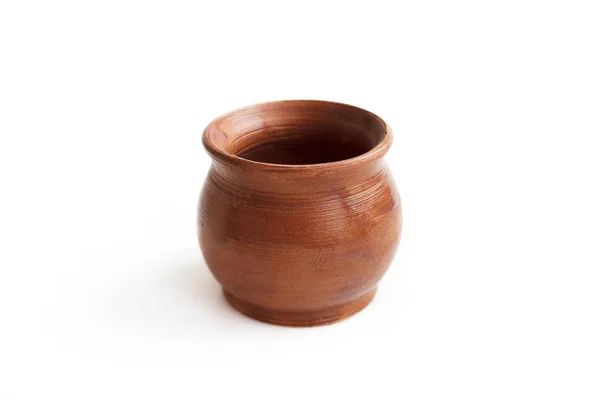 Clay pot, made by hand on a potter's wheel from red clay. Double burning. Transparent glaze applied by hand - visible potter's fingerprints and brush strokes. Handmade, single copy. White background, — 스톡 사진