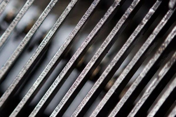 Hammers with letters, numbers and punctuation. Internal structure of the old Soviet typewriter close-up
