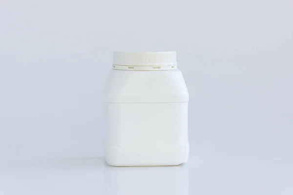 White plastic jar with lid on a white background — Stock Photo, Image