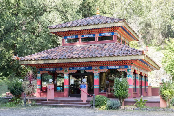 Land of Medicine Buddha Temple. Soquel, Santa Cruz County, California, USA. Buddhist shrine with Lantsa (Ranjana) scripts. The meaning is not literal but more symbolic about the mantras that give blessings when one walks under them.