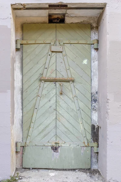 Ruins of a metal door at Battery West. Presidio of San Francisco, California, USA.