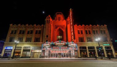 April 12, 2019 - Oakland, California: Fox Oakland Theatre at night with a crescent moon. The Fox Oakland Theatre is a 2,800-seat concert hall, a former movie theater, located in Downtown Oakland.  clipart