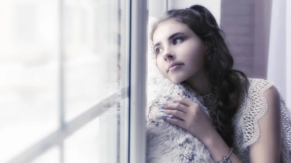 Beautiful Brunette Girl Sitting Windowsill Hugging Soft Beige Pillow Looking — Stock Photo, Image