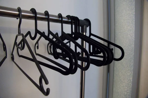 Line Black Plastic Empty Coat Hangers — Stock Photo, Image