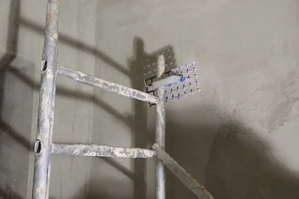 an old wooden ladder on a building site