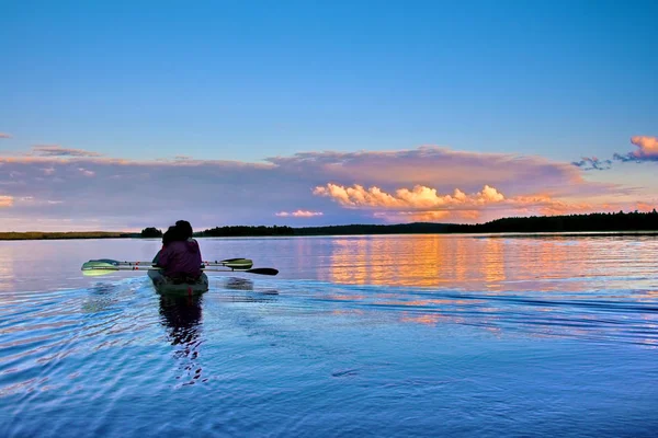 Kayaking on a lake at sunset, Karelia — Stock Photo, Image