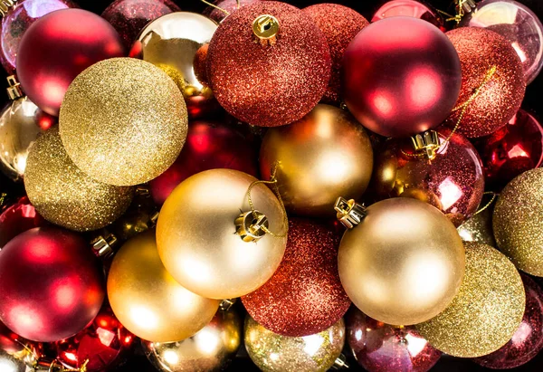 background of red and gold Christmas balls.
