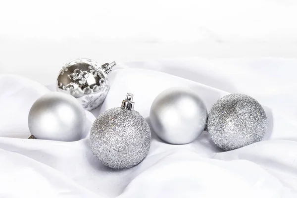 christmas card with silver christmas balls on white background