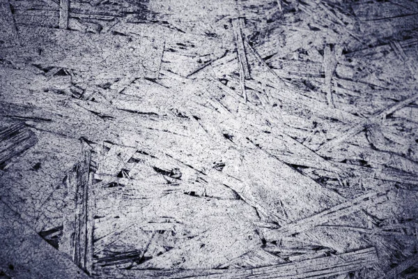 Grunge texture of oriented strand board, OSB, white background from pressed wooden panel. — Stock Image Grunge texture of oriented strand board, OSB, white background from pressed wooden panel. Royalty Free Stock Photos