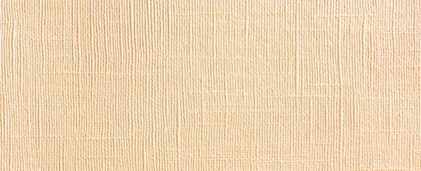 Background of natural material, decorative matting. Light wallpaper with linen texture. Backdrop from fiberboard. Pressboard structure with pattern of embossing. Facing, finishing material.