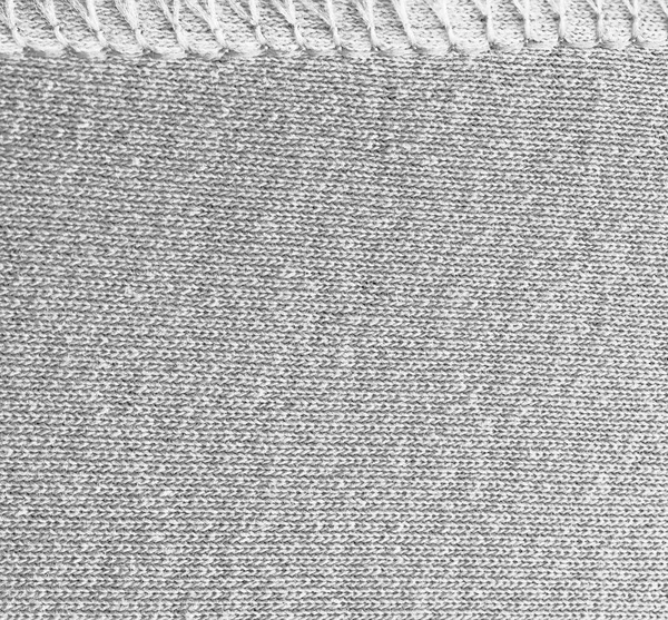 Tissu tricoté léger vide avec éléments décoratifs, texture tricotée avec coutures . — Photo
