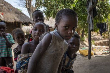 Orango Island, Guinea-Bissau - February 3, 2018: Group of children at the village of Eticoga in the island of Orango. clipart