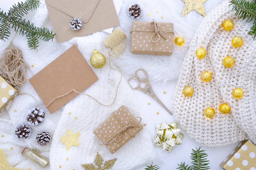 Flat lay chrismas composition with handmade gift box and decoration golden.