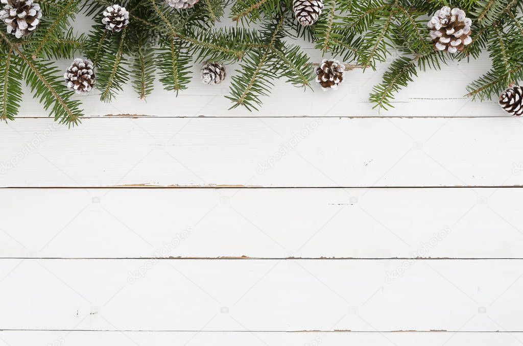 Christmas decoration Fir tree with snow Pine cones on white background Flat lay frame mockup. Minimal design