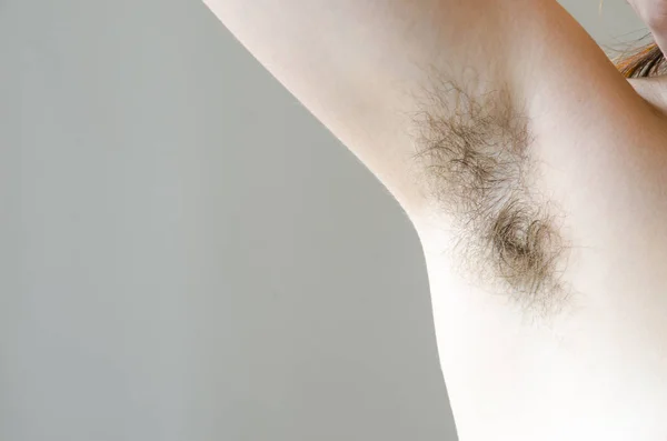 Hairy womans armpit, close-up, unshaven, a lot of hair on the armpit — Stock Photo, Image