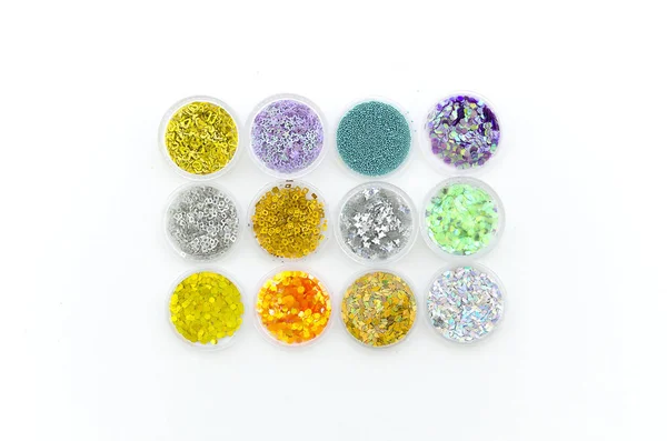 samples of nail glitter powder.Manicure DIY Nail Art Decoration Glitter Pigment Set. Flat lay, top view